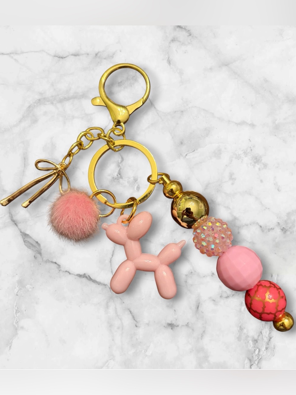Pink Balloon Dog Keychain with Pom Pom and Gold Accents